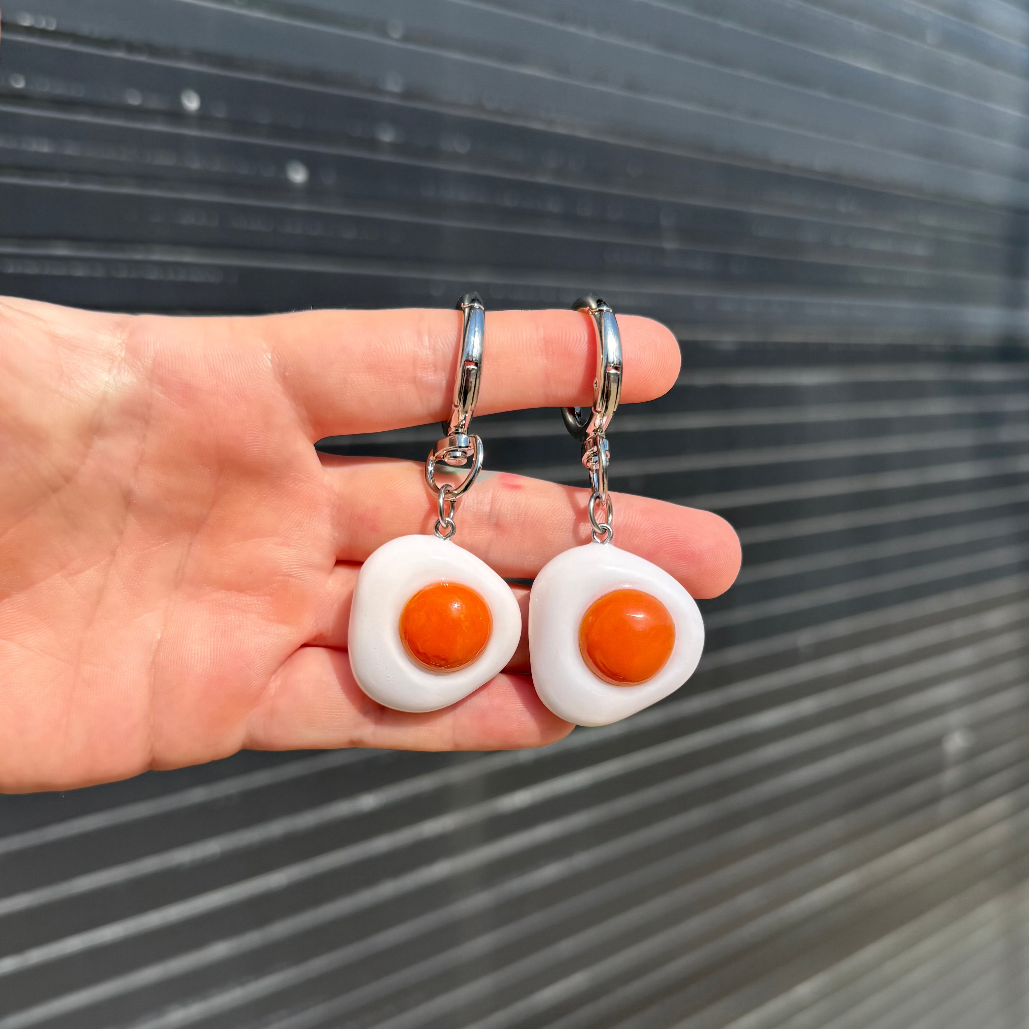 two egg charms dangling from keychains
