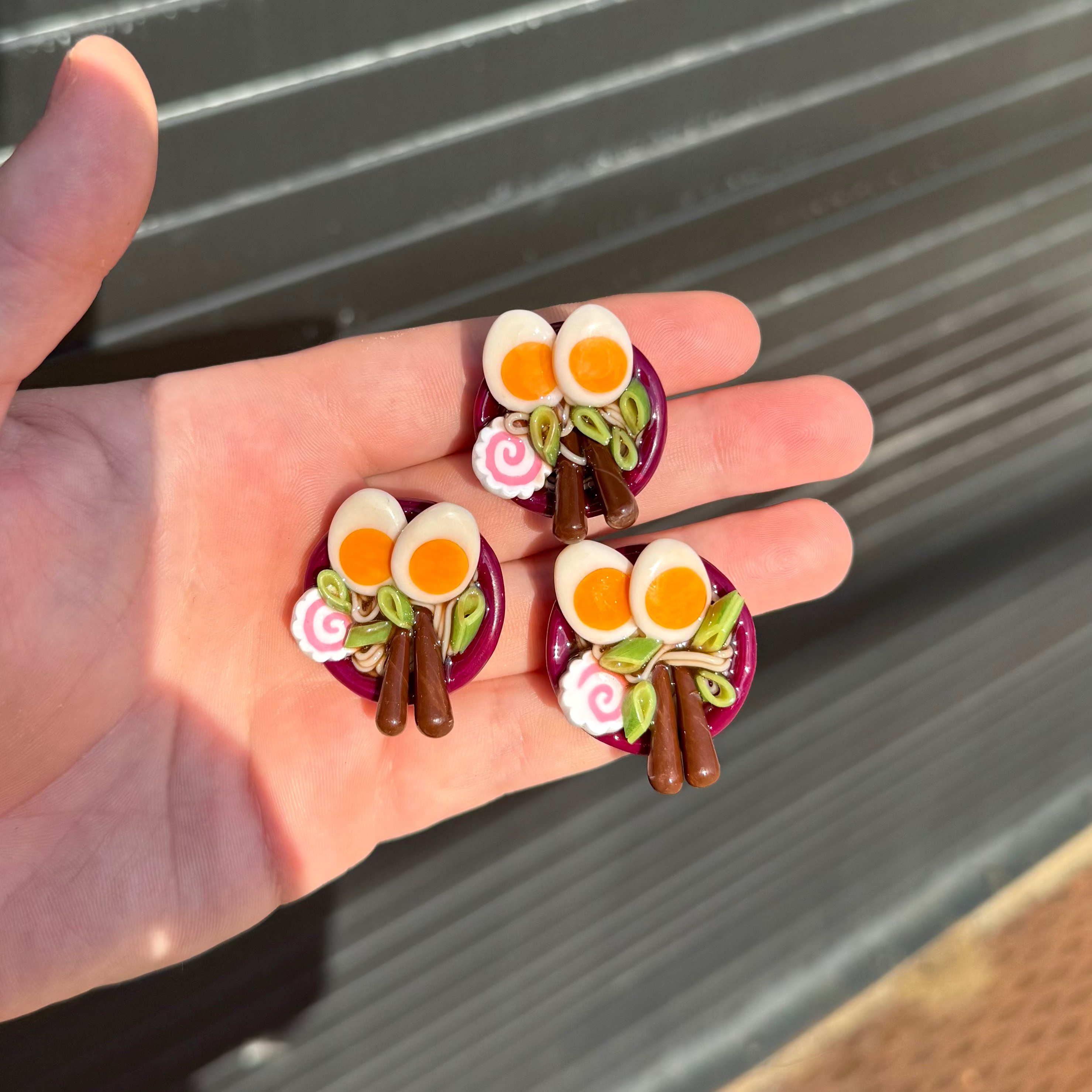 three small ramen bowl shaped polymer clay magnets. 